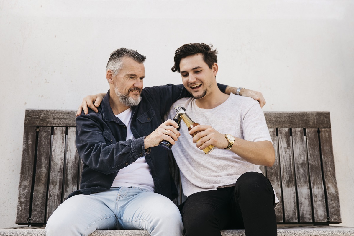 father and son bench with beer